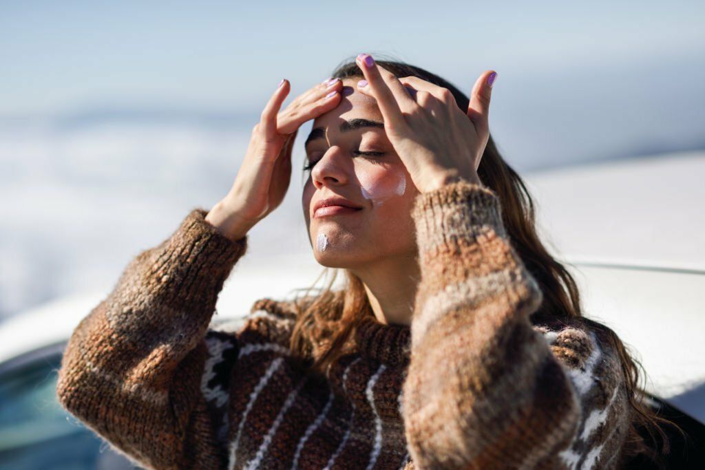 Girl Applying Sunscreen